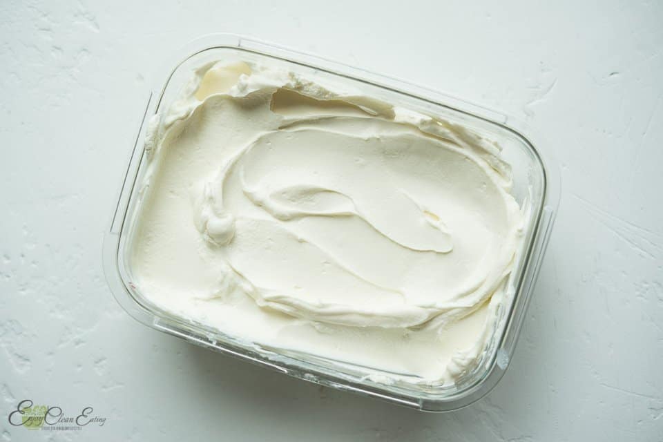 thick and creamy instant pot greek yogurt in a glass food storage container.
