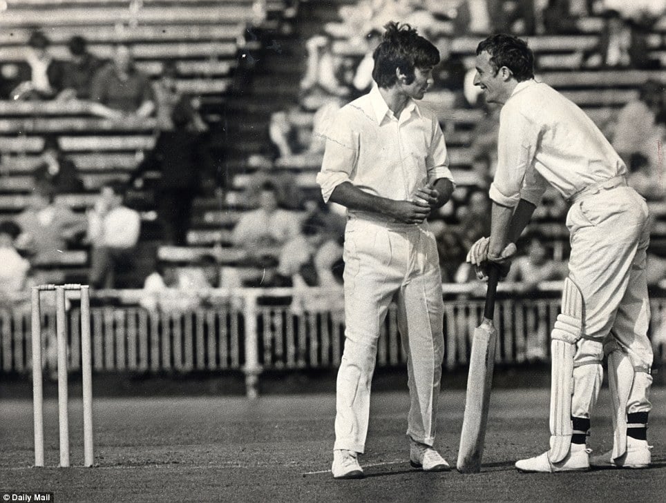 He was the "Jack of all trade"s: Best discusses tactics with Mike Summerbee while taking part in a benefit match for Lancashire player Ken Higgs at Old Trafford in 1968.