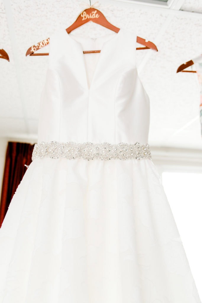 wedding dress hanging on the hanger