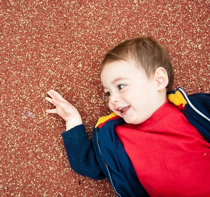 julie_kubal_091029_gallery_014-cropped Baby boy lying on ground in playground