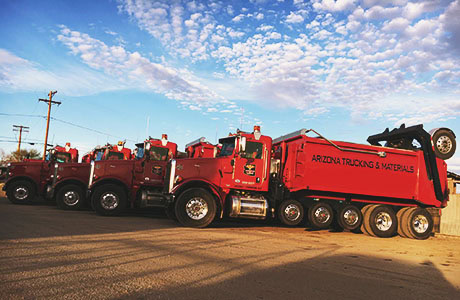 Flatbed & Dump Truck Rentals In Tucson, Arizona Arizona Trucking & Materials offers large truck rentals to move your rocks, sand, gravel and other landscaping materials. Our truck rental options range from flat bed trucks to large, 18-wheel, 25-ton dump trucks.