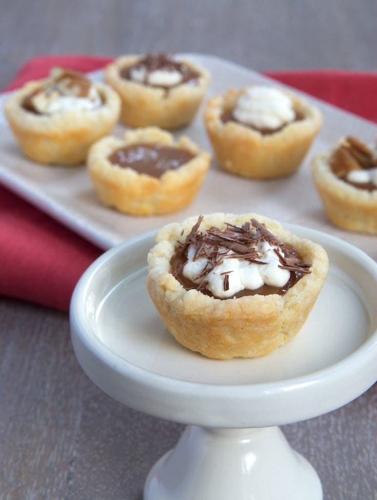 Mini Caramel Tarts combine a cream cheese crust with a rich caramel filling that can be topped with whipped cream, salt, chocolate, or your favorite topping. - Bake or Break