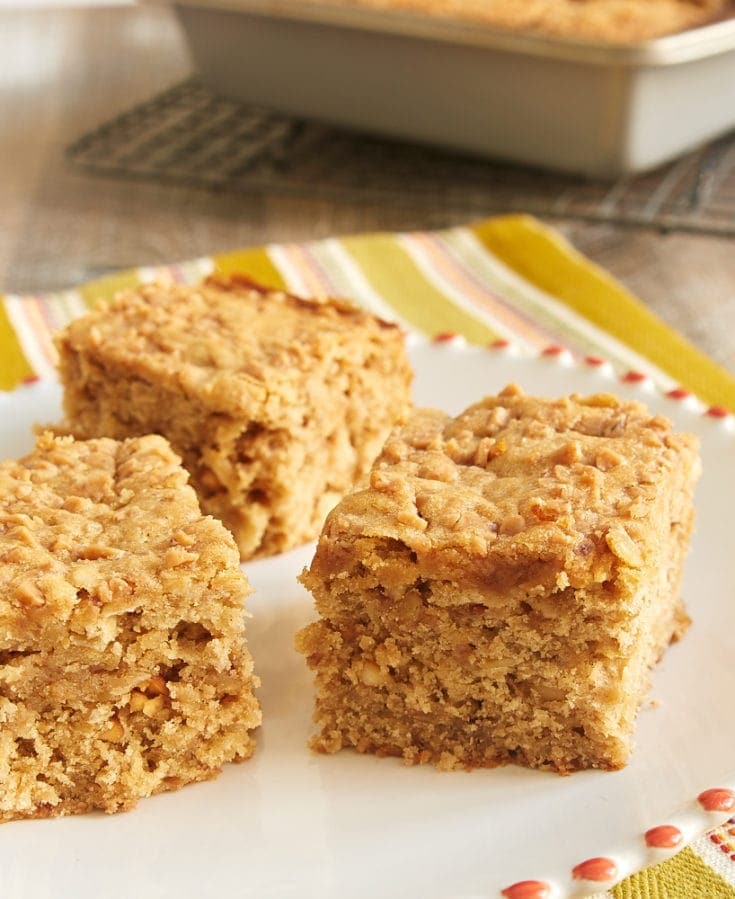 Peanut Butter Toffee Snack Cake on a red-rimmed white plate