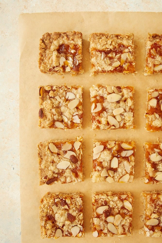 Apricot Almond Oat Bars on parchment paper