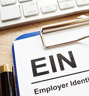 employer identification number (EIN) on clipboard paper.
