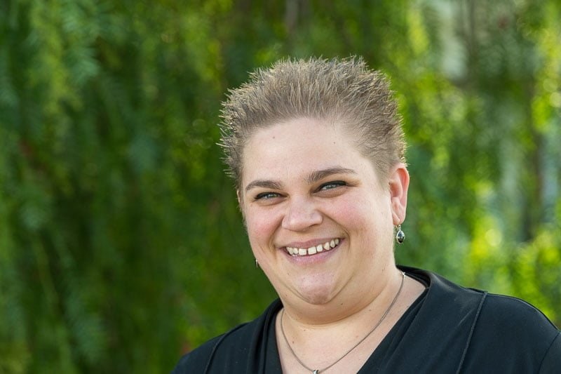 funeral celebrant with verdant background