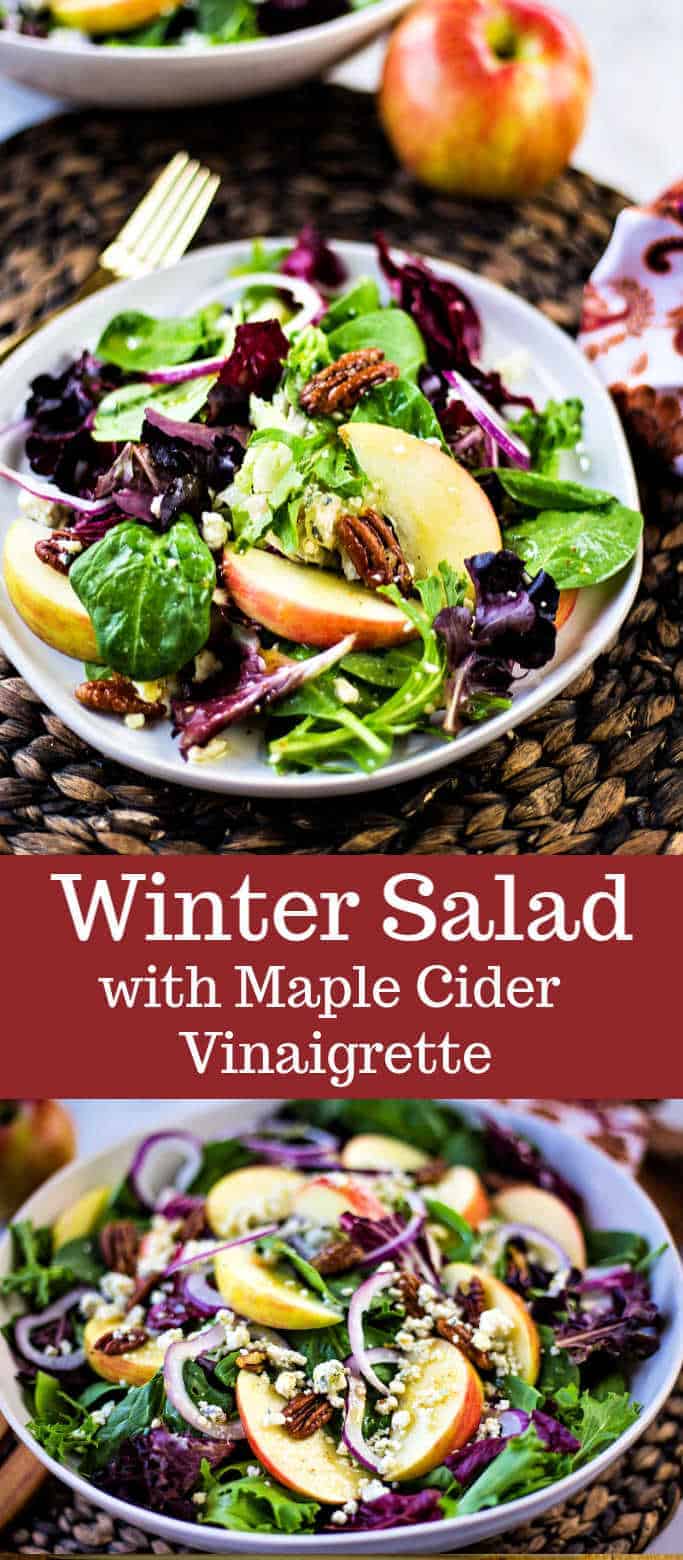 Winter Salad with Maple Cider Vinaigrette features crisp apples, red onion, and blue cheese crumbled all tossed together with salad greens and sprinkled with homemade candied pecans.