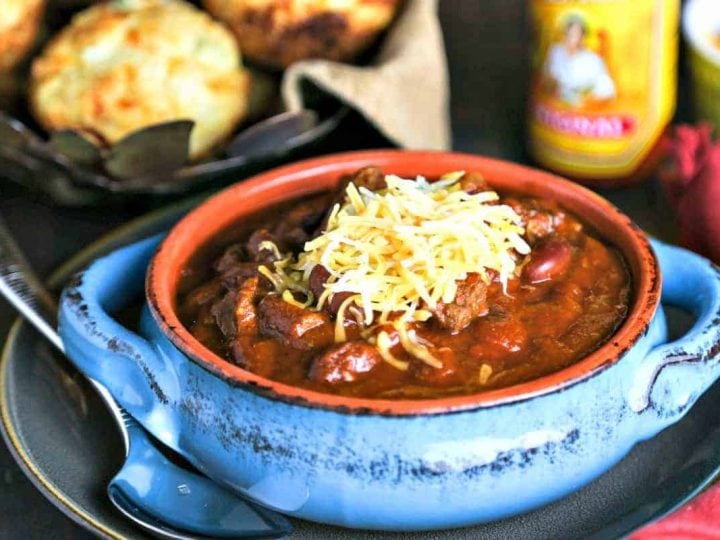 A bowl of Slow Cooker Tex-Mex Chili topped with cheese