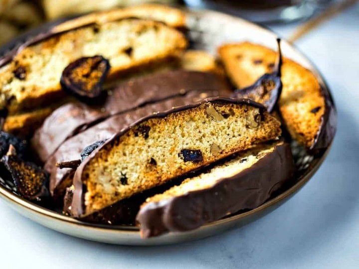 Fig Walnut Chocolate Dipped Biscotti on gold plate