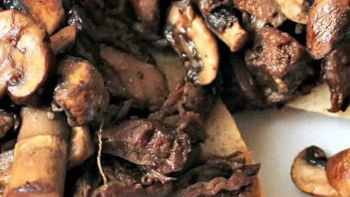 French Dip. Slow Cooked beef, a slice of cheese and sandwiched between a lovely toasted Ciabatta roll, and a bowl of au jus for dipping. YUMMY!