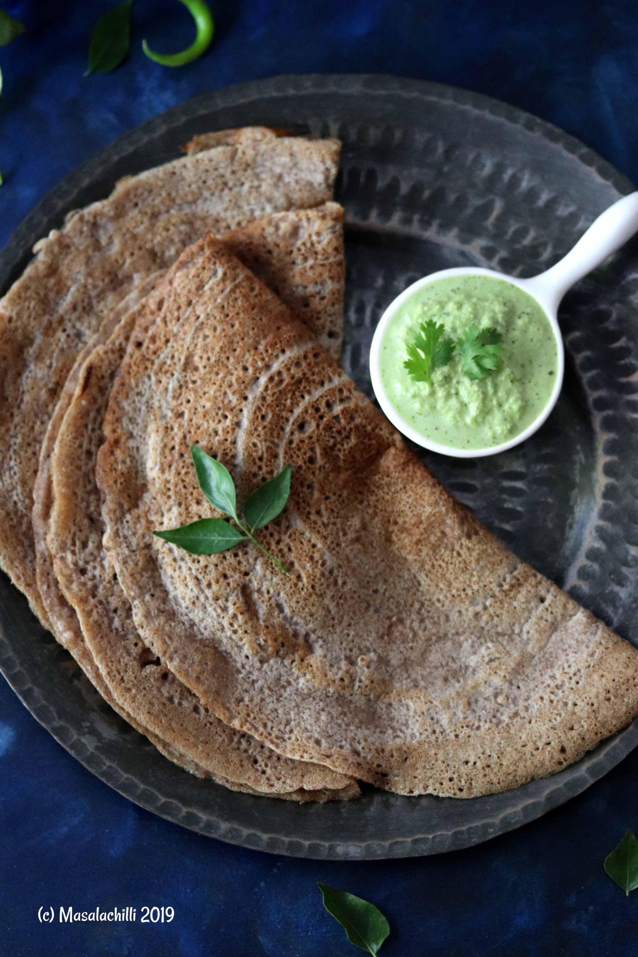 Millet Dosa served with coriander coconut chutney