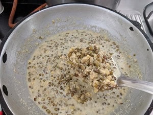 Water is added to adjust consistency of the curry