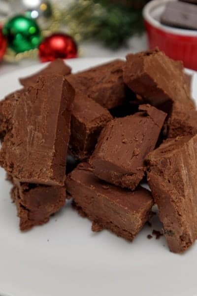 15-minute fudge recipe. Easy and delicious every time. No Candy thermometer needed! Best tasting fudge ever! via @Mooreorlesscook