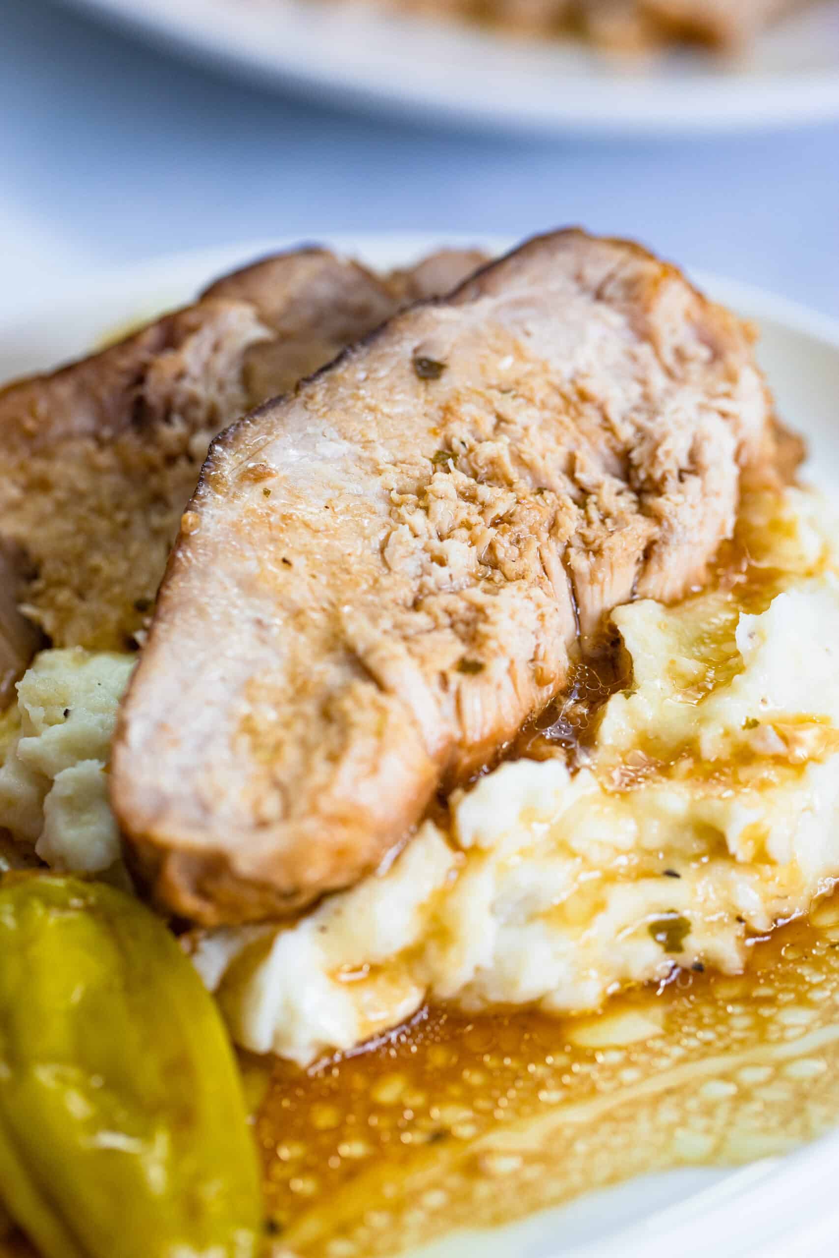 Slow Cooker Mississippi Pork Roast is the most simple meal that is made in the slow cooker/crockpot. Just set it and forget it for a tender to the touch pork roast that is incredibly flavorful and melts in your mouth delicious. This Slow Cooker roast is savory, sweet, and spicy. Takes only 5 minutes to prep and can be paired with tons of sides. via @Mooreorlesscook