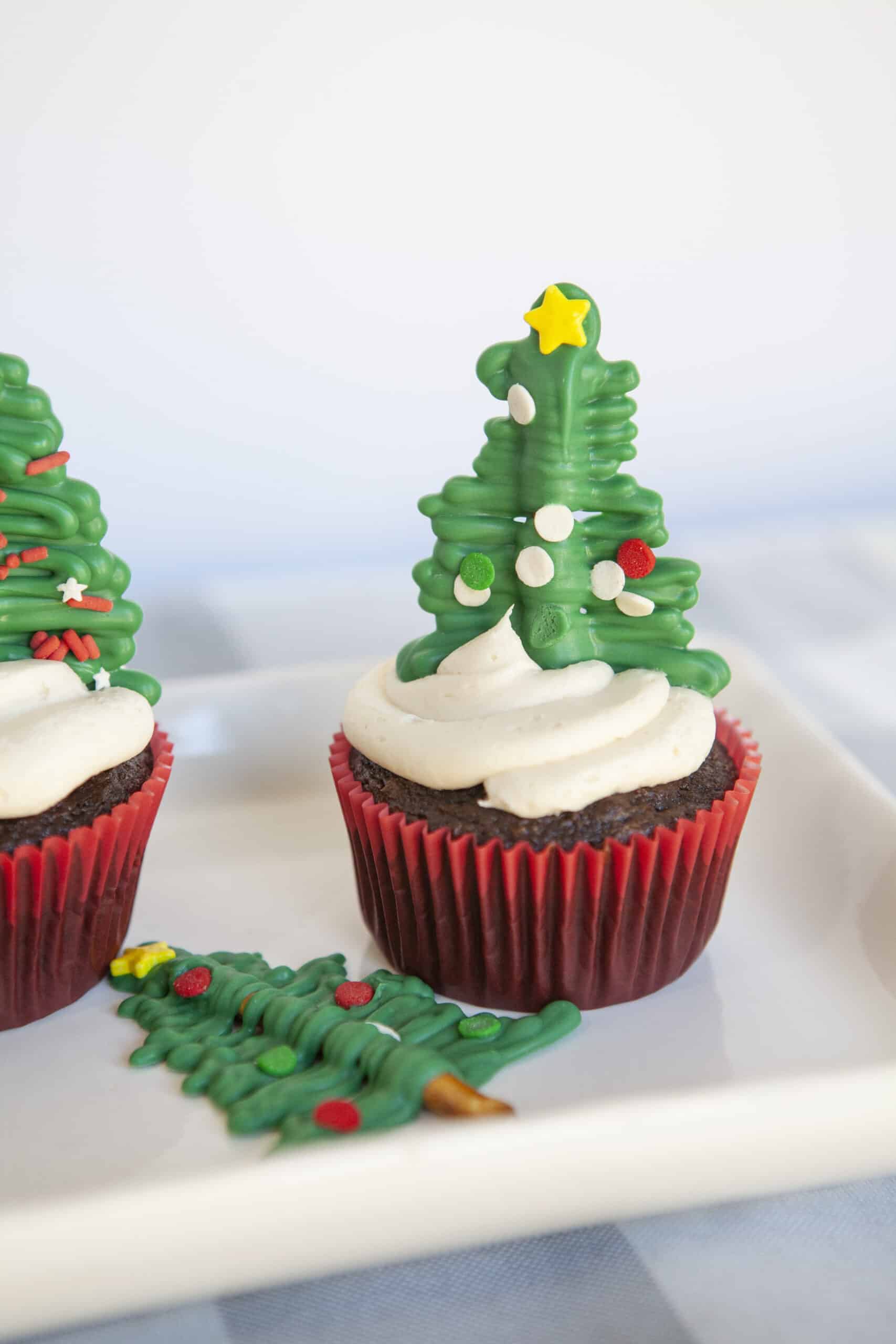 These Christmas Tree Cupcakes will be an instant hit with kids as well as adults this holiday season. Sitting on top of each delicious cupcake is a cute evergreen tree topper that’s made out of chocolate and pretzels! It’s an easy craft that’s perfect for a decorating party. via @Mooreorlesscook