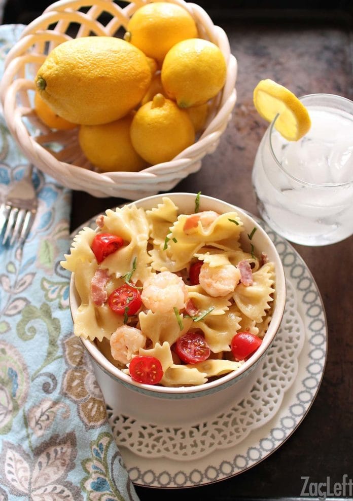 shrimp and prosciutto with pasta in a bowl