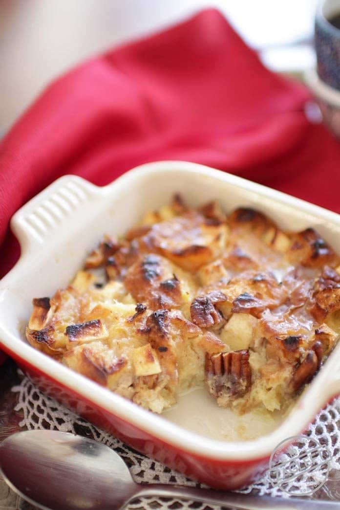 breakfast bread pudding filled with pecans and apples served in a small dish | one dish kitchen