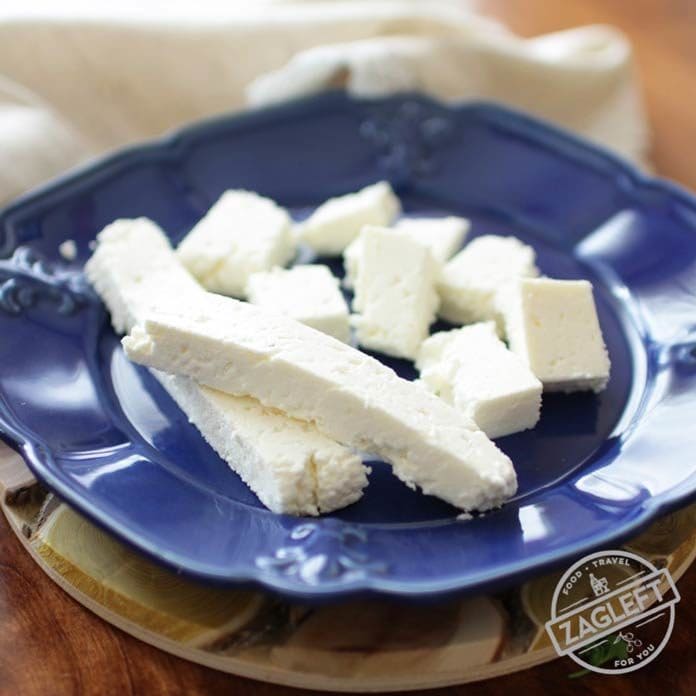 a blue plate filled with paneer cheese