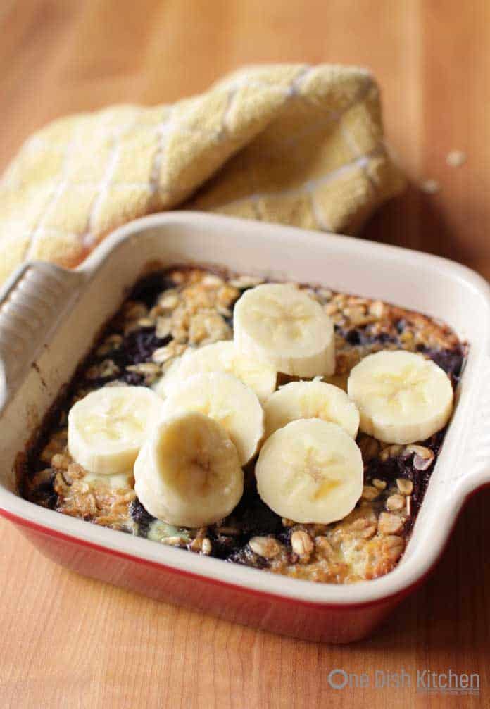 dish of baked oatmeal topped with fruit | One Dish Kitchen