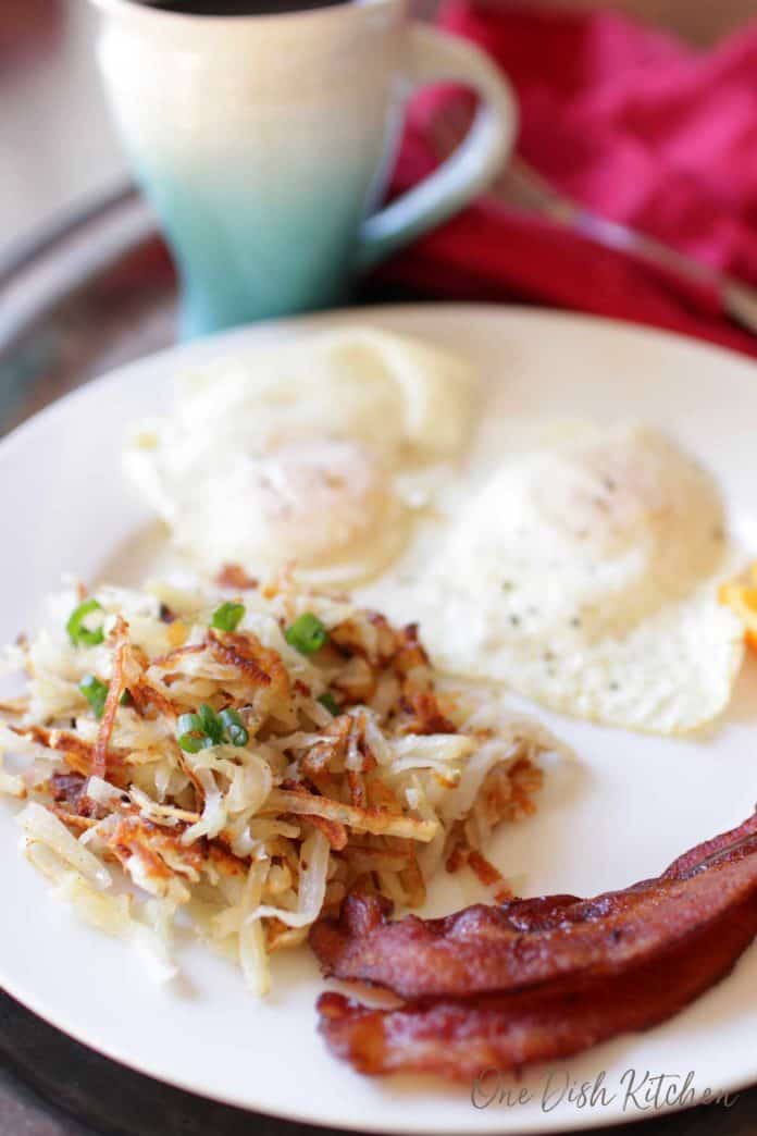 hash browns with bacon and eggs on a plate | one dish kitchen
