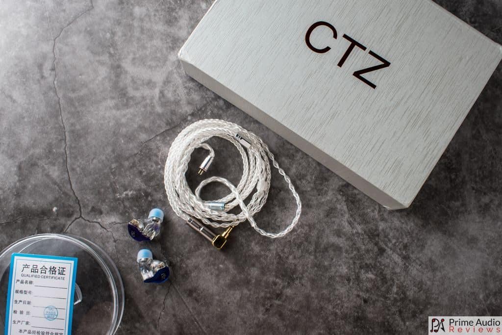 Box, cable, in-ear monitors and case.
