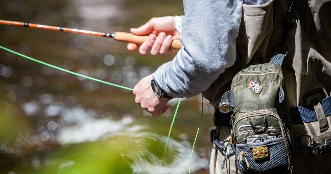 Stonetree Creative-Braley Fly Fishing-6686 Man fly fishing in river in Maine - Stonetree Creative