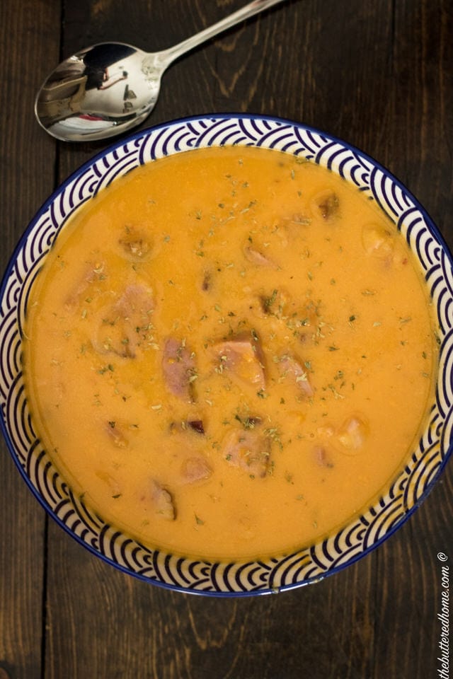 a bowl full of ham and Sweet Potato Soup