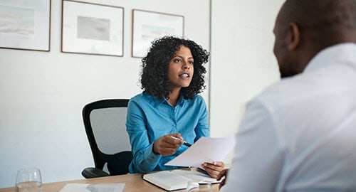 Man and woman having a meeting in office