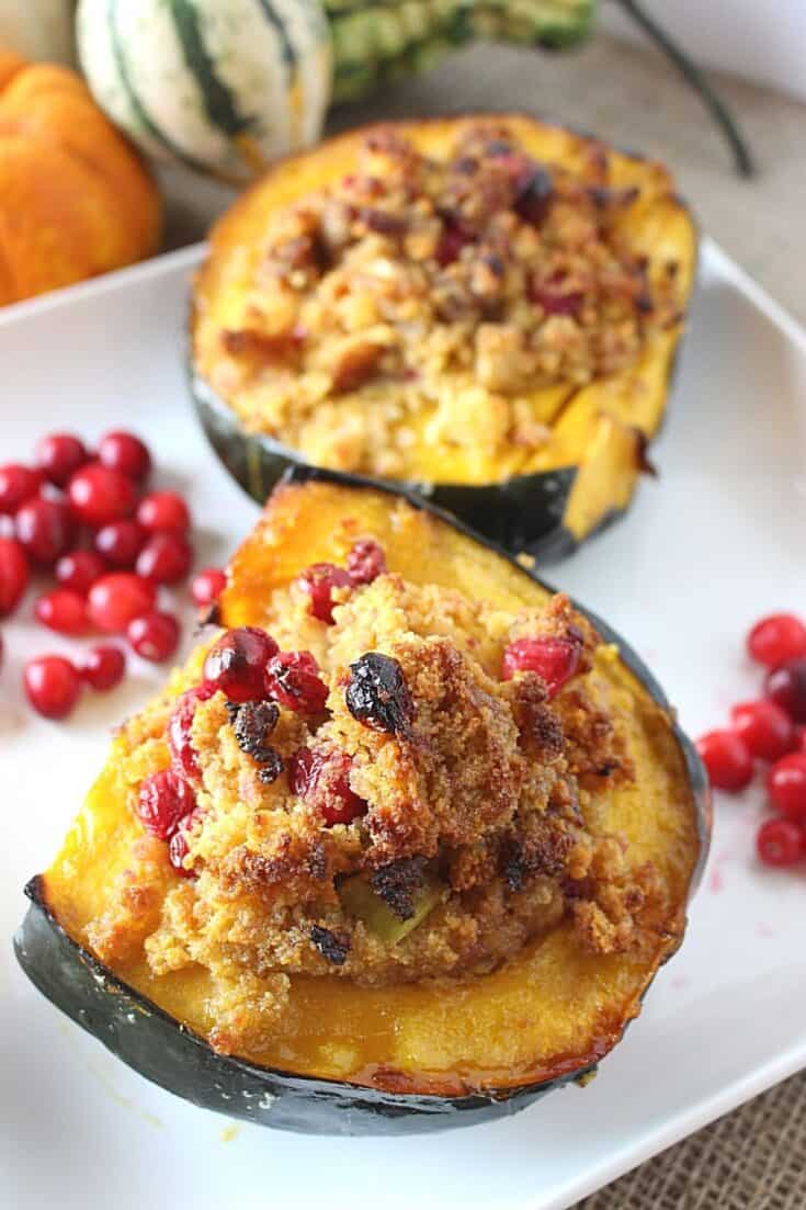 Roasted Acorn Squash with Cornbread Sausage Stuffing is a perfect recipe for Thanksgiving and fall. Fresh cranberries, cornbread and sausage round out this stuffed acorn squash recipe.