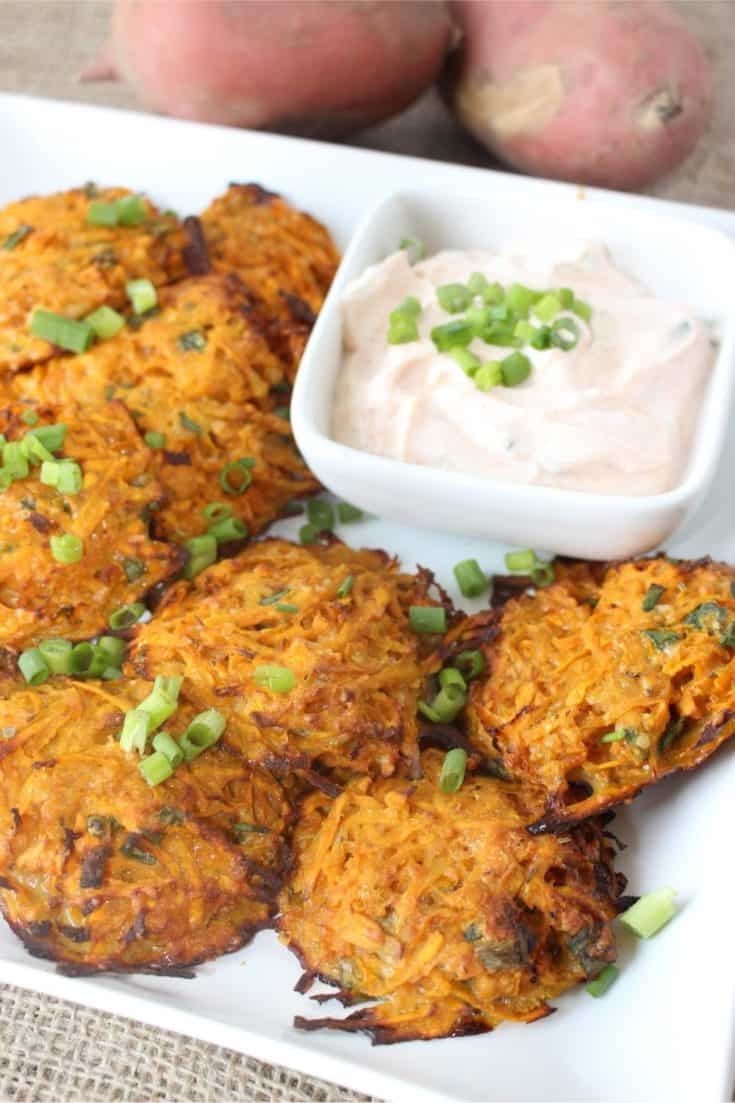 Baked sweet potato fritters are a delicious and healthy recipe. This dish is a perfect side dish or appetizer. This sweet potato fritter recipe is perfect to make in the fall or any time fo the year. #fritters #sweetpotatoes