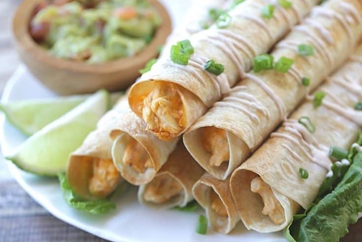 These Baked Buffalo Chicken Flautas as crispy, cheesy and full of buffalo chicken flavor. Feed a crowd this Cinco de Mayo with these delicious Baked Buffalo Chicken Flautas. If you love Mexican food, try this easy Mexican recipe. Flautas are quick and easy to prepare. Flautas are a great make-ahead freezer meal too.