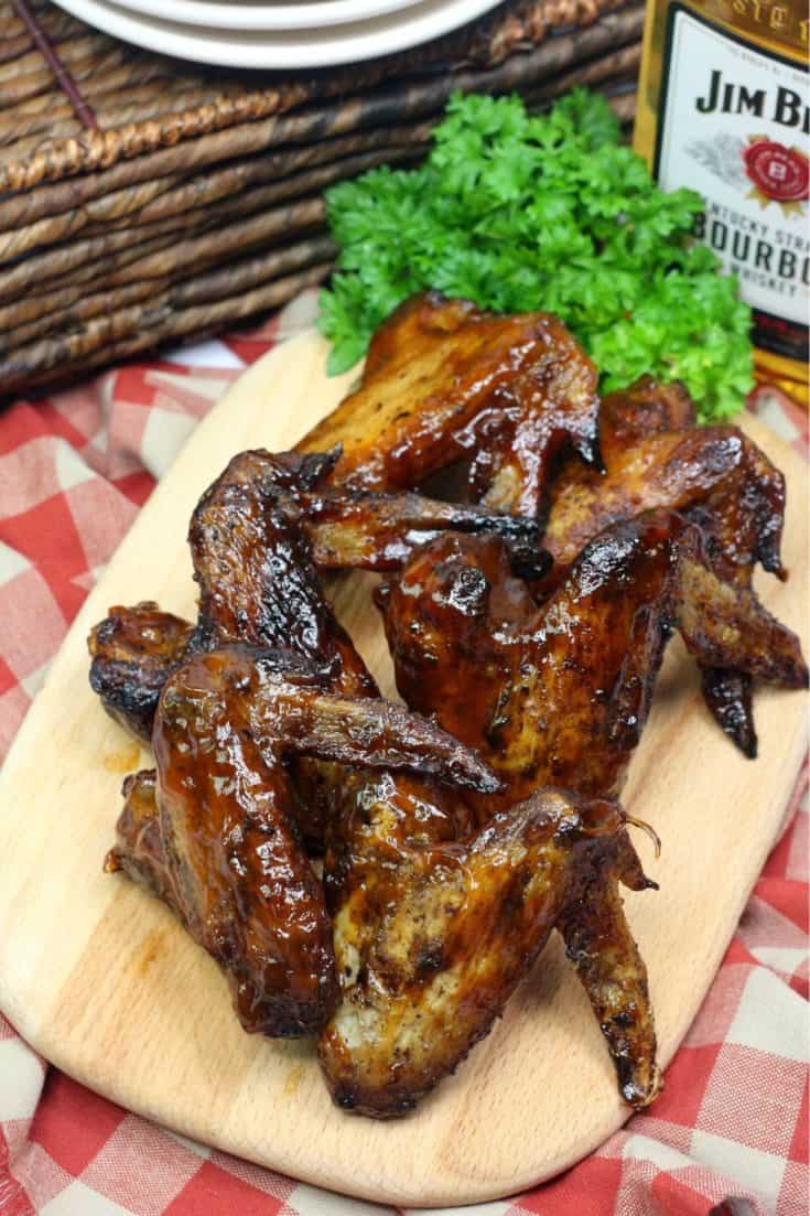 Wow your crowd at your next bbq or summer gathering. These Grilled Bourbon Chicken Wings are a deliciously simple grilled chicken recipe. #wings #grilledchickenwings #wingrecipe #bbq