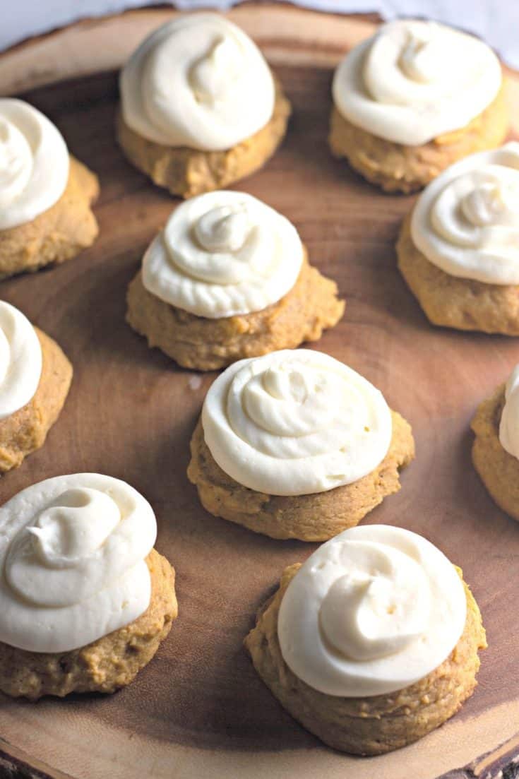 These Bakery Style Soft Pumpkin Cookies are soft and mildly sweet with just the right amount of pumpkin spice. The cream cheese icing is the perfect topping make this pumpkin cookie recipe a perfect fall treat. #pumpkincookies #pumpkinrecipe #falldessert #cookierecipe
