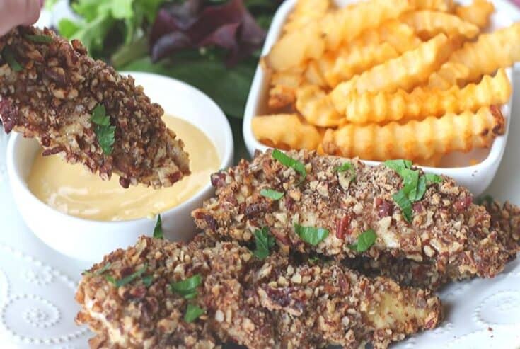This baked Pecan Crusted Chicken recipe has a whole lot of flavor and a delicious pecan crunch. Enjoy these chicken tenders as is, with dipping sauce or on top of a salad.