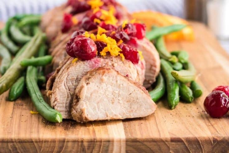 This Slow Cooker Pork Tenderloin With Cranberries & Orange is a delicious fix it and forget it holiday Crock Pot recipe.