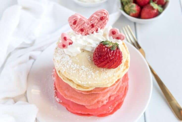 These Pink Ombre Pancakes are the perfect homemade Valentine's Day Pancake Recipe. Your family will love these light and fluffy pancakes. Share some love and make easy pancake recipe can be served all year long. #valentinesdaypancakes #ombrepancakes