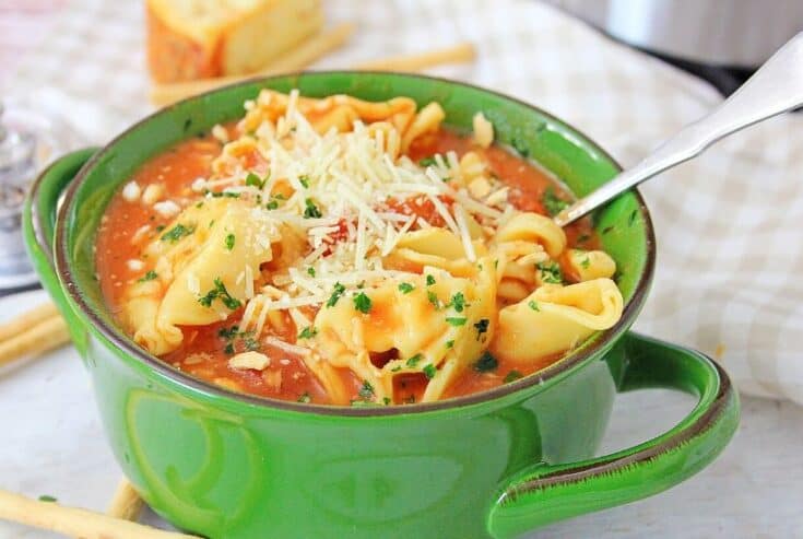 Warm yourself up with a bowl of this Instant Pot Chicken Parmesan Soup. This easy instant pot soup is a delicious comfort food recipe. This easy Chicken Parm soup recipe will be a family favorite.