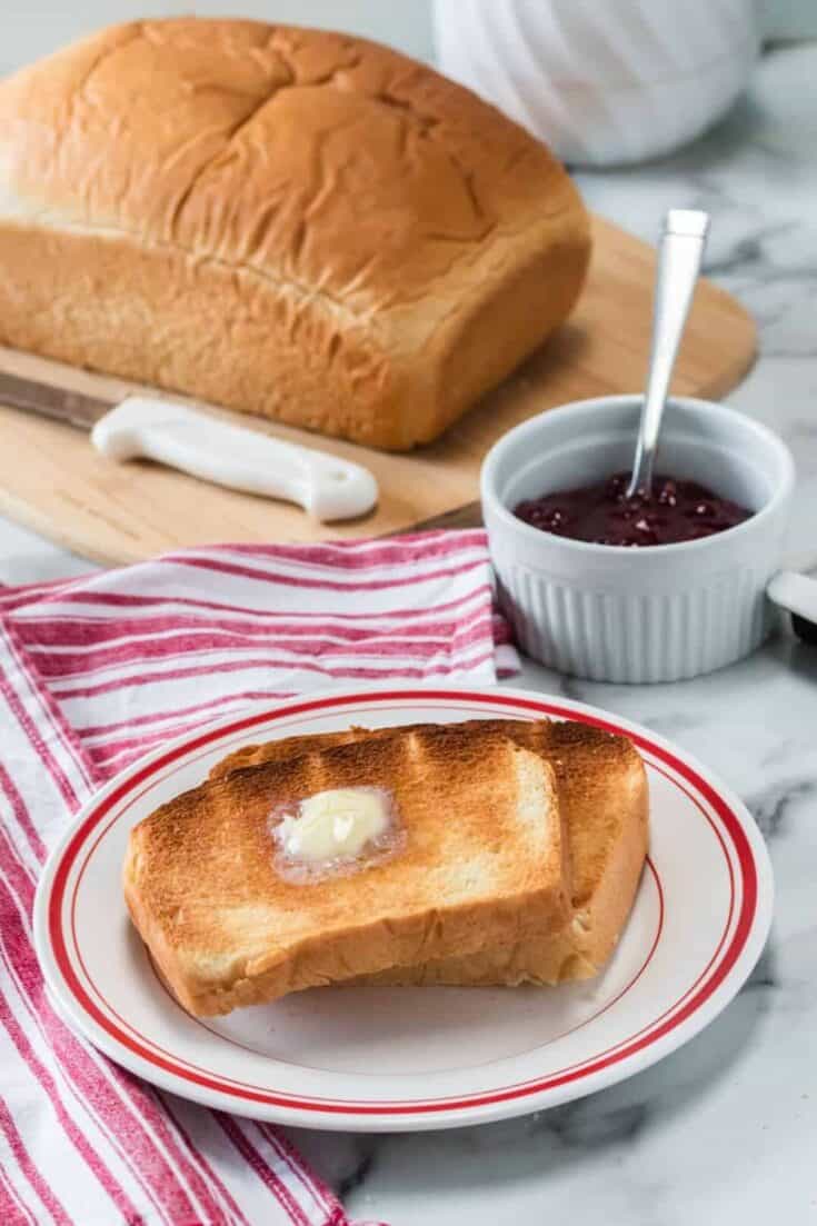 This Homemade Country White Bread makes two delicious loaves of bread. This easy bread recipe is perfect for sandwiches, toast or just a smear of butter.