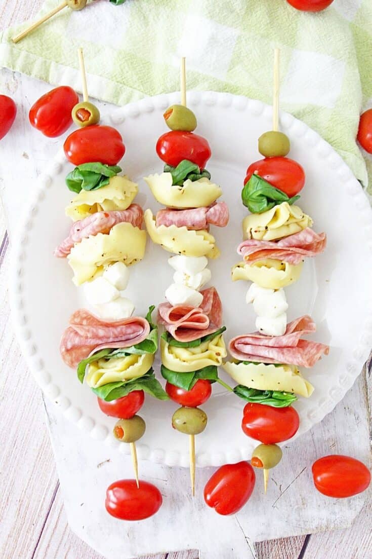 These make-ahead Tortellini Antipasto Skewers Appetizers are an easy and delicious party recipe or snack idea. This super easy antipasto recipe feeds a crowd too.