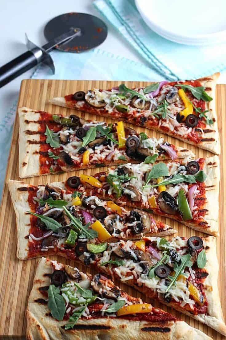 It's time to fire up the grill and turn a traditional pizza recipe into an easy and delicious Grilled Pizza. Here's How To Make the Perfect Grilled Pizza recipe.