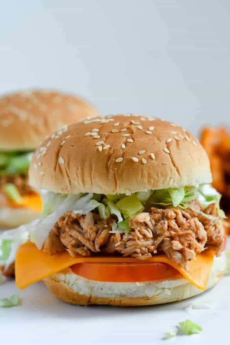 Looking for an easy weeknight meal? These Shredded BBQ Chicken Sandwiches are a delicious solution. Your family will love these barbecue chicken sandwiches. This easy sandwich recipe is great to serve at a party, football tailgate or game day celebration.