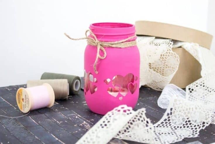 Grab some chalk paint and transform a mason jar into these Painted Mason Jar Valentine Lantern. This is an easy DIY Valentine's Day craft. Easy cricut craft project.