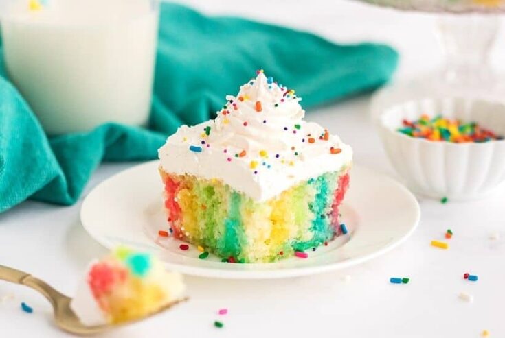 Make a colorful, moist, and utterly delicious cake within minutes with this Rainbow Poke Cake recipe. It is full of flavor and plenty of fun colors, including shades of pink, blue, and yellow!
