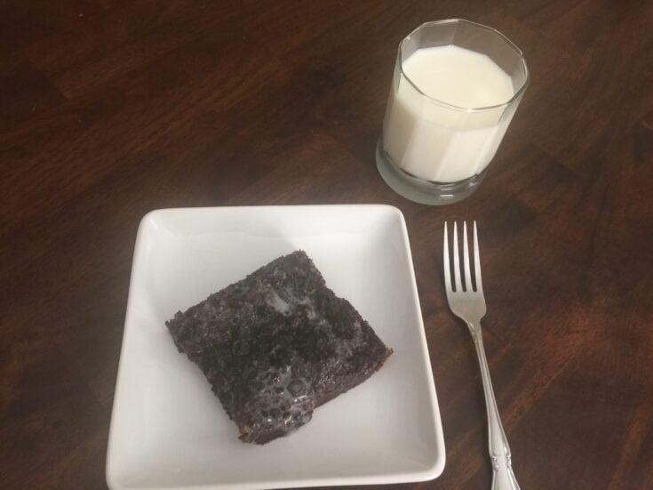 Oreo Brownie Slice on a White Plate with a Glass of MIlk