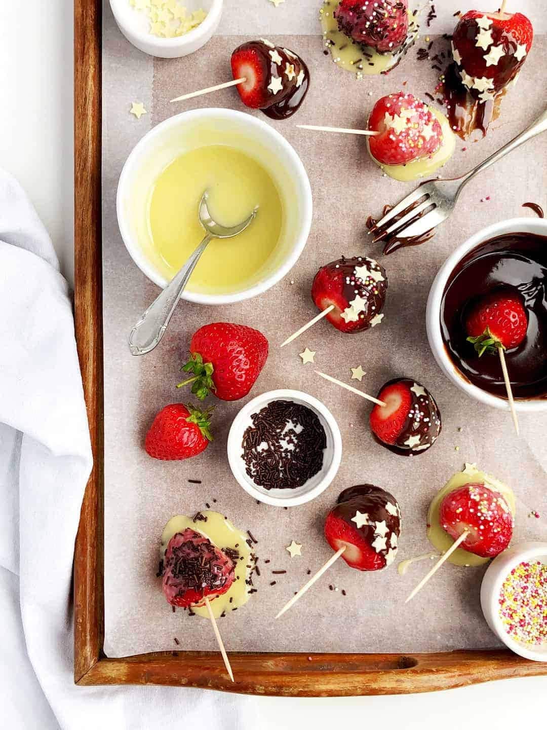 Summer dessert - fresh strawberries dipped in milk chocolate
