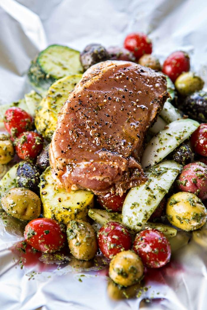 Pesto Pork Chop and Summer Vegetable Foil Dinners