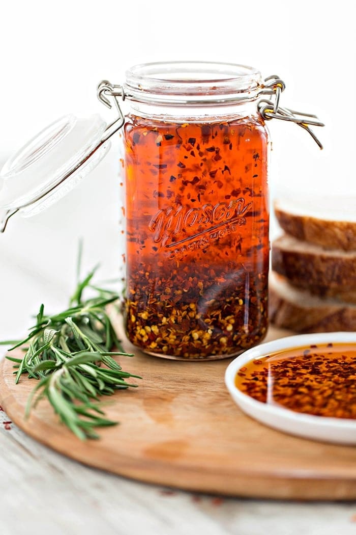 jar of dipping oil on cutting board