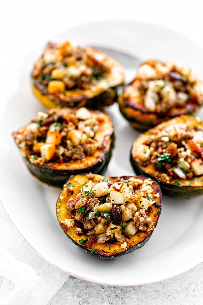 stuffed acorn squash on white plate