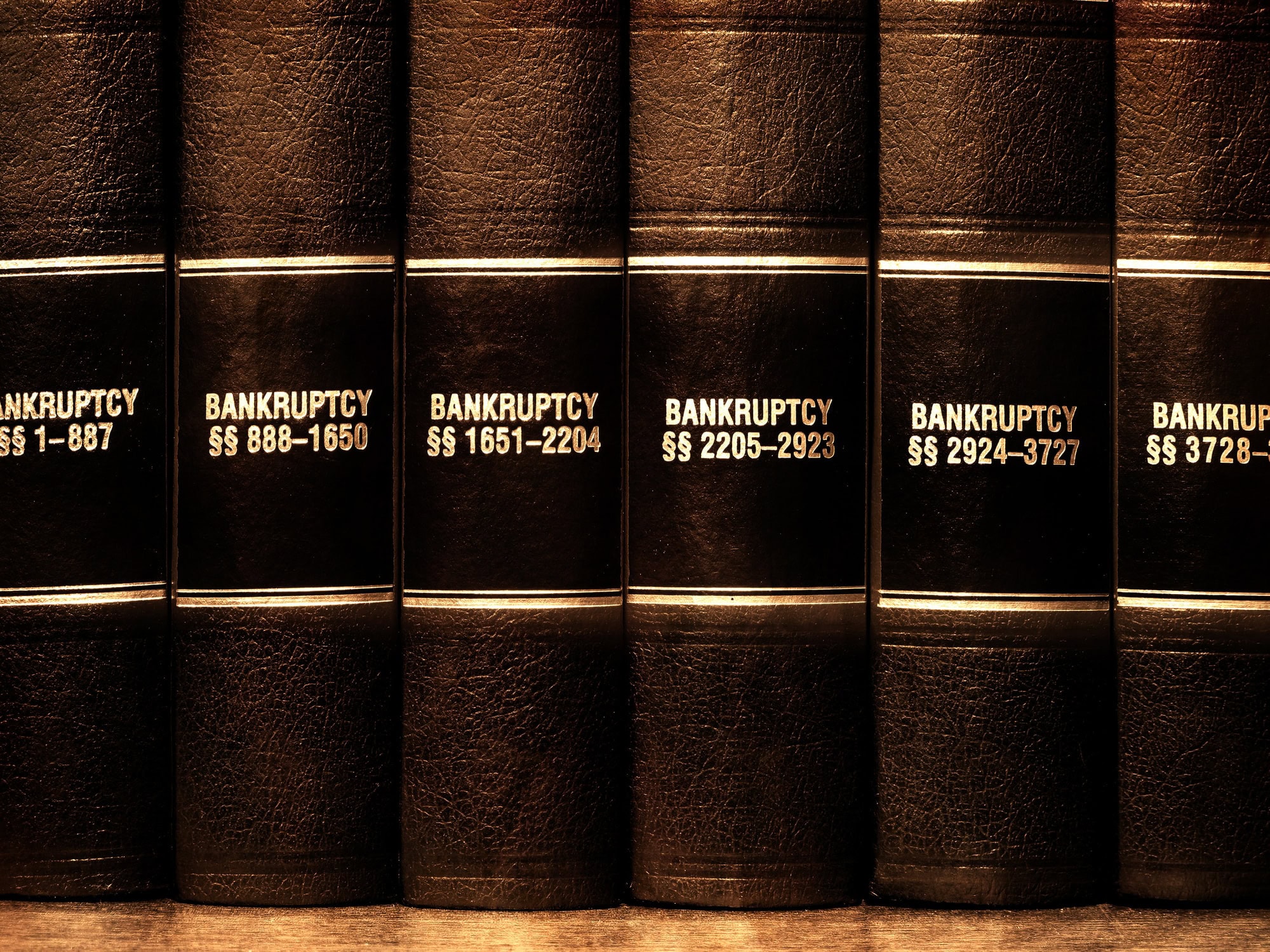 Law Books on Bankruptcy Close up of several volumes of law books of codes and statutes on bankruptcy