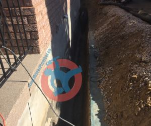 Trench for exterior foundation wall waterproofing s